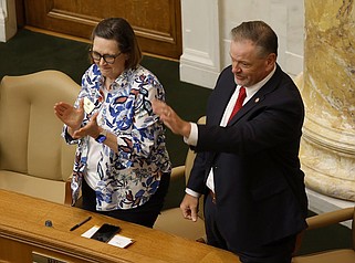 Rep. Brian Evans, R-Cabot, waves Thursday after being elected as the House-speaker-designate as members of the House applaud including Rep. Karilyn Brown, R-Sherwood. (Arkansas Democrat-Gazette/Thomas Metthe)